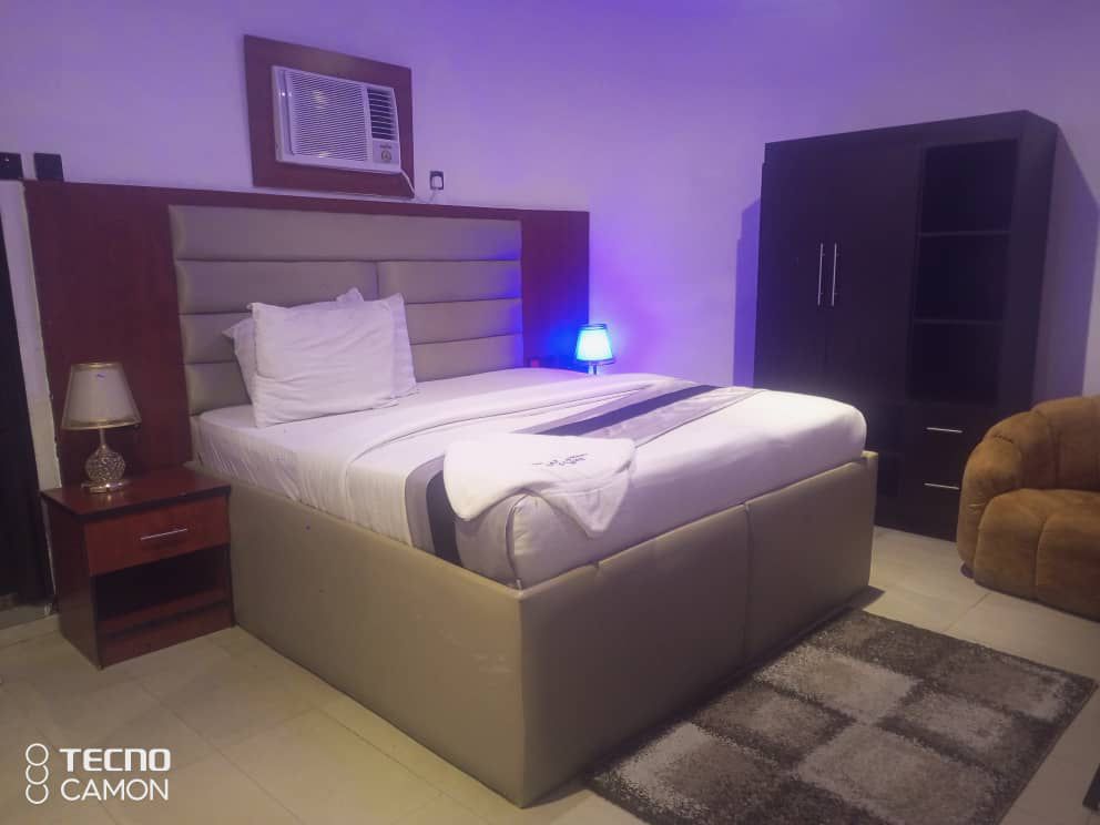 Luxury hotel room with beige tones and modern amenities